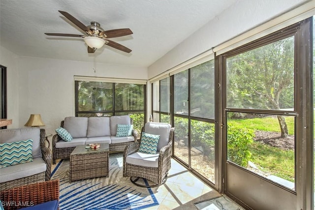 sunroom featuring ceiling fan