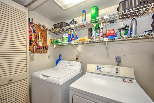laundry area with laundry area and washer and clothes dryer