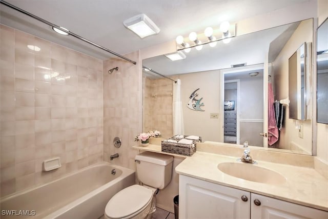 bathroom with shower / bath combination, vanity, and toilet