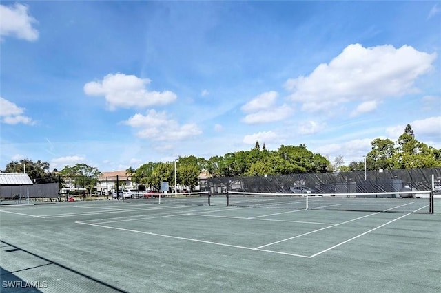 view of sport court with fence
