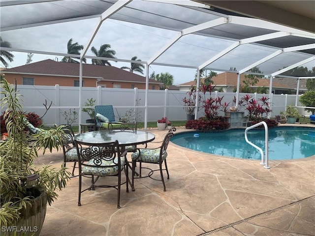 view of swimming pool with a patio, a fenced backyard, a fenced in pool, and a lanai