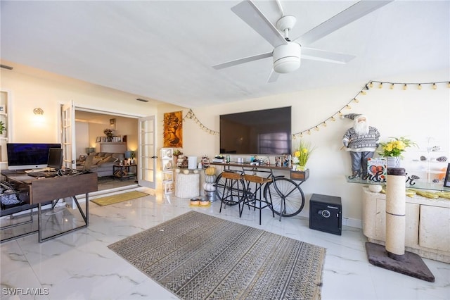 interior space with visible vents, baseboards, marble finish floor, and ceiling fan