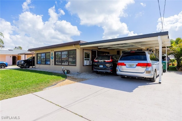 view of vehicle parking with an attached carport and driveway