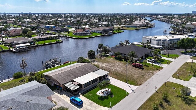 bird's eye view with a residential view and a water view