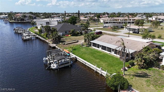 aerial view with a residential view and a water view