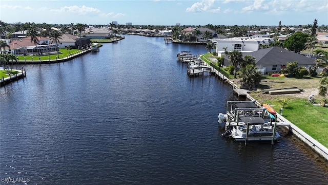 property view of water featuring a residential view and a dock