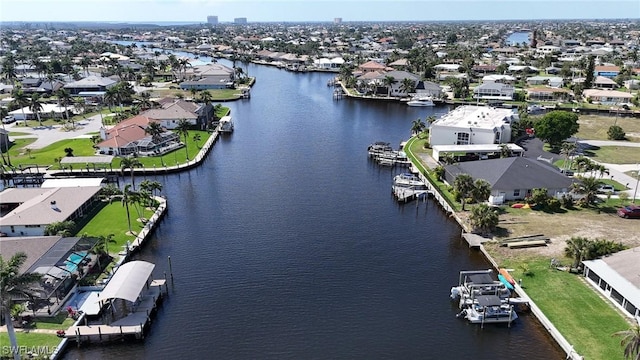 birds eye view of property featuring a residential view and a water view