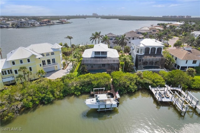 bird's eye view with a water view and a residential view