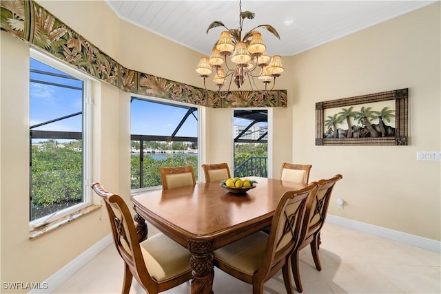 dining area with a notable chandelier, plenty of natural light, and baseboards