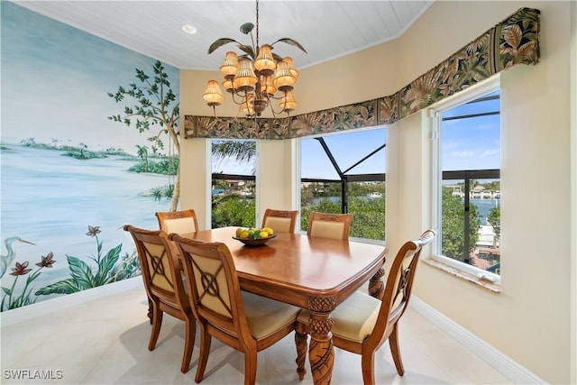 dining area featuring an inviting chandelier and baseboards