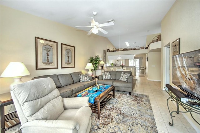 living room with lofted ceiling, light tile patterned floors, and a ceiling fan