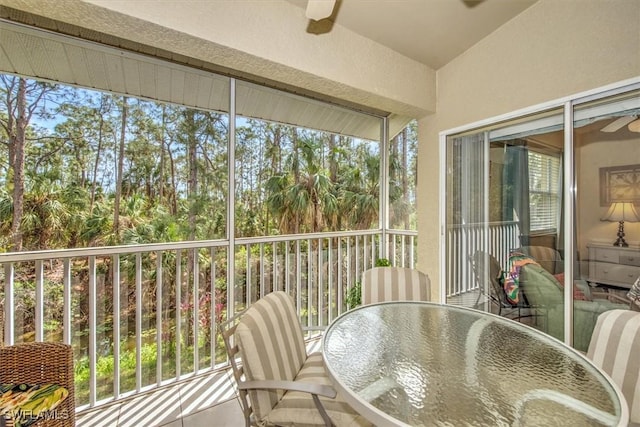 sunroom featuring ceiling fan