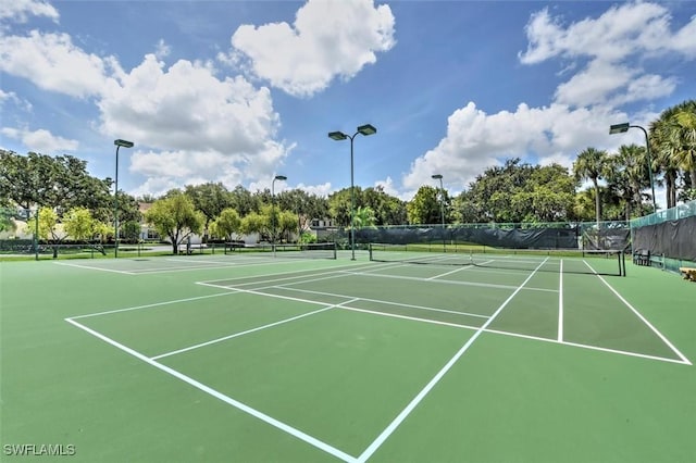 view of sport court with fence