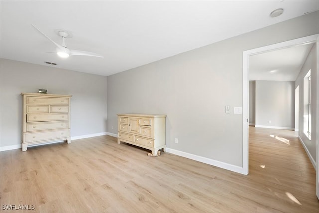 unfurnished bedroom with light wood-style floors, baseboards, visible vents, and a ceiling fan