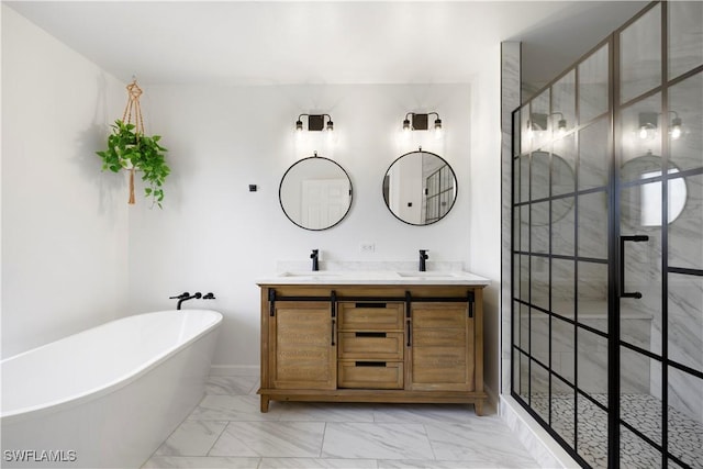 bathroom with marble finish floor, double vanity, a soaking tub, a sink, and tiled shower