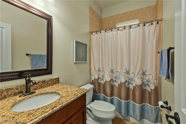 full bathroom with a shower with shower curtain, vanity, and toilet