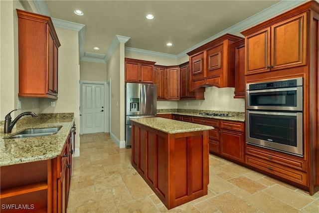 kitchen featuring light stone countertops, stone tile floors, appliances with stainless steel finishes, and a sink