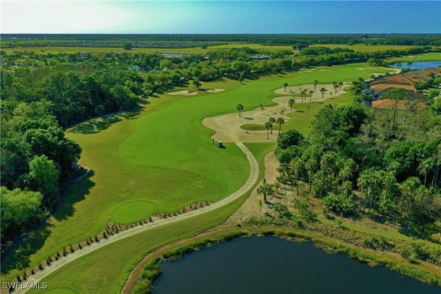 drone / aerial view featuring view of golf course and a water view