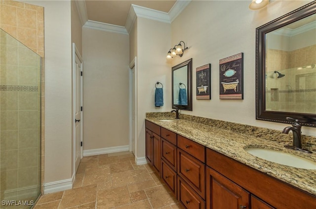 full bath with stone tile floors, crown molding, a tile shower, and a sink