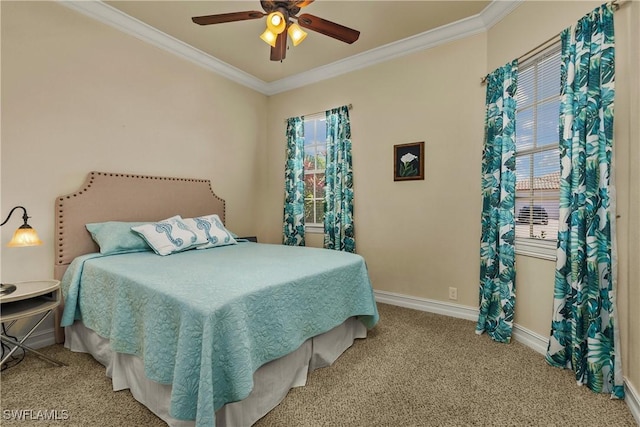 carpeted bedroom with ornamental molding, a ceiling fan, and baseboards