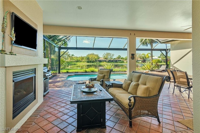 view of patio with an outdoor living space with a fireplace, a lanai, and an outdoor pool