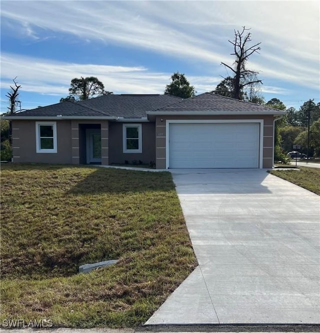 ranch-style house featuring a garage, a shingled roof, driveway, stucco siding, and a front yard