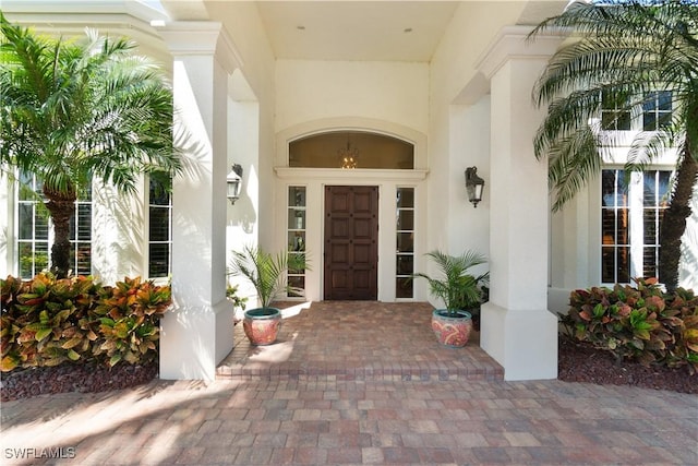 property entrance with stucco siding