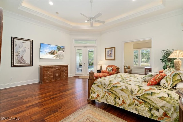 bedroom featuring access to exterior, crown molding, a raised ceiling, and wood-type flooring