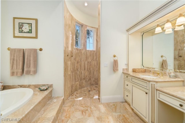 bathroom with vanity, baseboards, a walk in shower, a garden tub, and marble finish floor