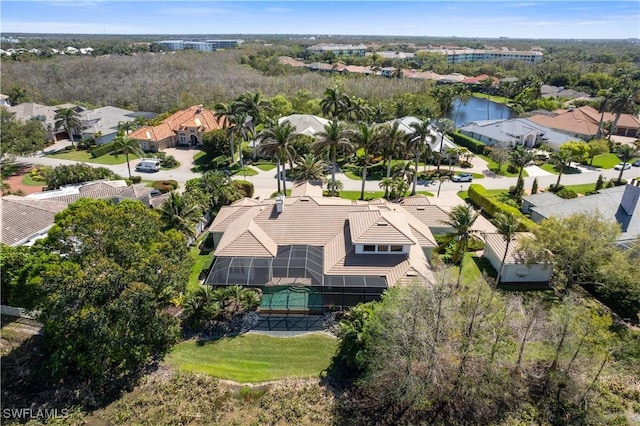 birds eye view of property featuring a residential view and a water view