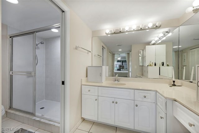 full bathroom with connected bathroom, a sink, a shower stall, and tile patterned floors