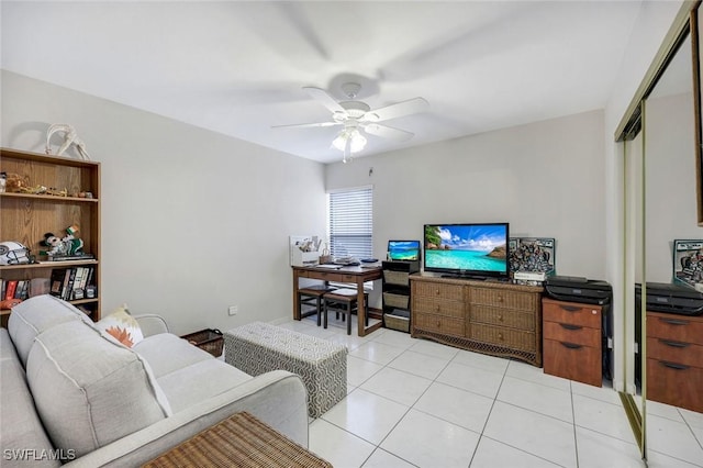 living room with light tile patterned flooring and a ceiling fan