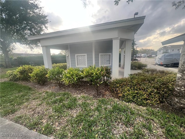 view of side of home with fence