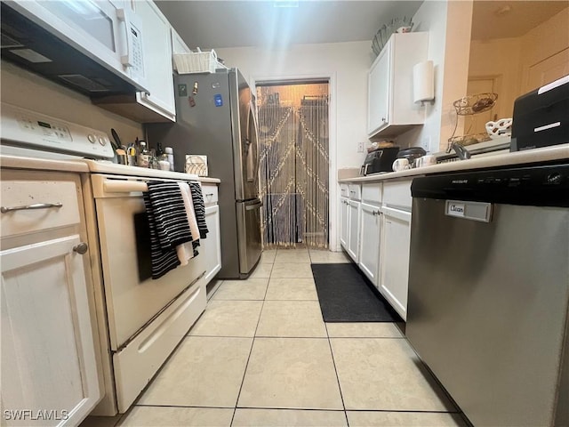 kitchen with white cabinetry, light countertops, light tile patterned floors, and stainless steel appliances