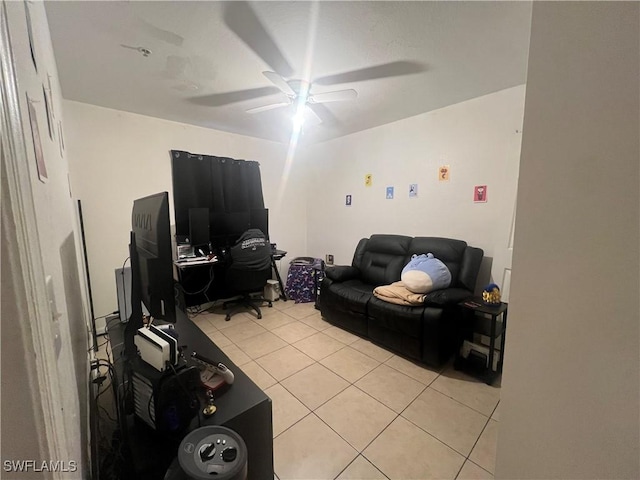 living room featuring ceiling fan and light tile patterned flooring