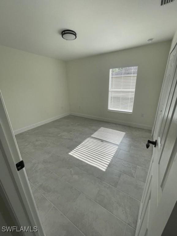 interior space with visible vents and baseboards