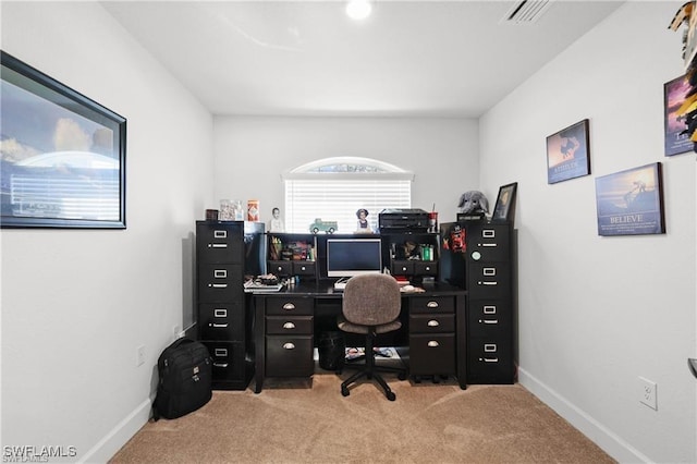 home office featuring light colored carpet, visible vents, and baseboards