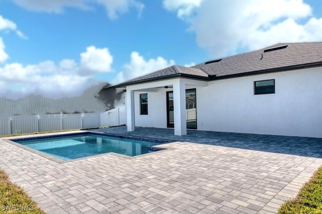 view of pool with a patio area, ceiling fan, fence, and a fenced in pool