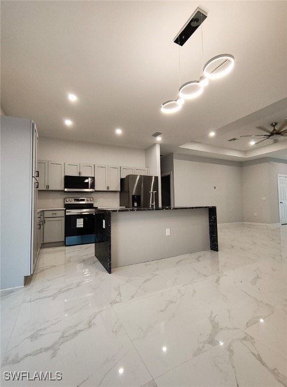 kitchen featuring recessed lighting, marble finish floor, appliances with stainless steel finishes, hanging light fixtures, and gray cabinets