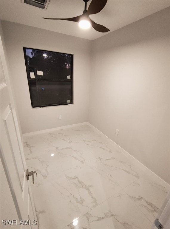 unfurnished room featuring visible vents, marble finish floor, a ceiling fan, and baseboards