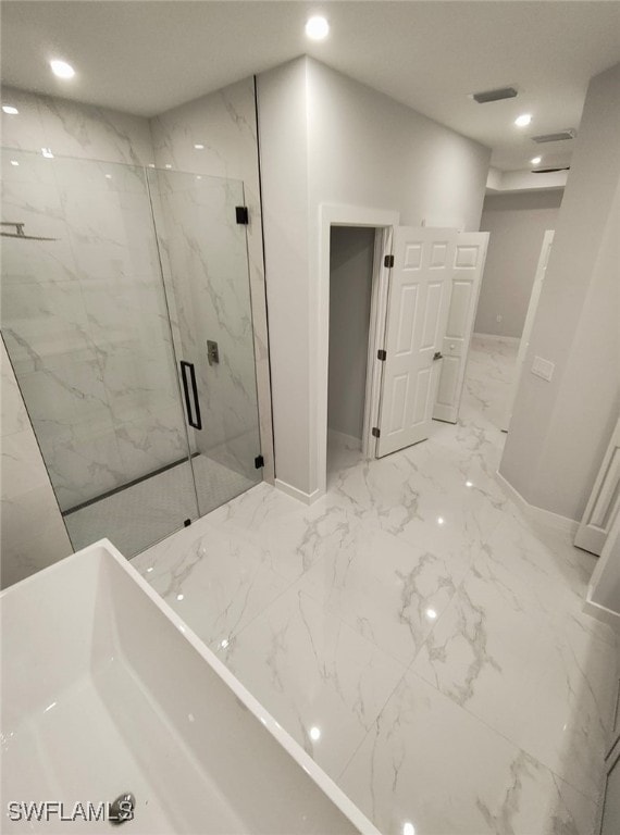 bathroom with marble finish floor, a marble finish shower, visible vents, and recessed lighting