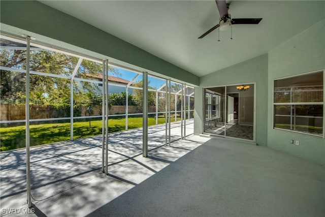 unfurnished sunroom with lofted ceiling and ceiling fan with notable chandelier