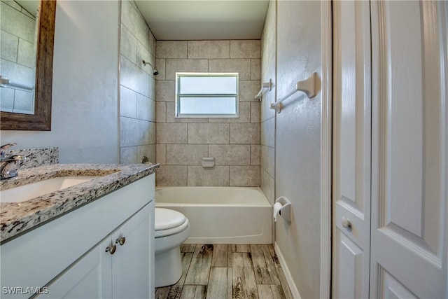 full bathroom with shower / bathing tub combination, vanity, toilet, and wood finished floors