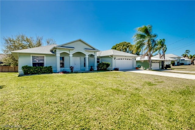 ranch-style home with driveway, an attached garage, a front lawn, and stucco siding