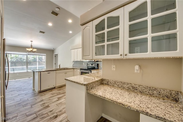 kitchen with a peninsula, visible vents, white cabinets, stainless steel electric stove, and dishwasher