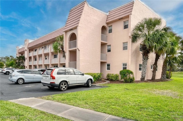 view of property with uncovered parking