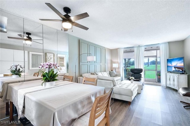 interior space featuring a textured ceiling and wood finished floors