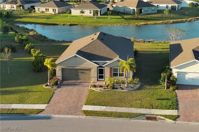 bird's eye view with a water view and a residential view