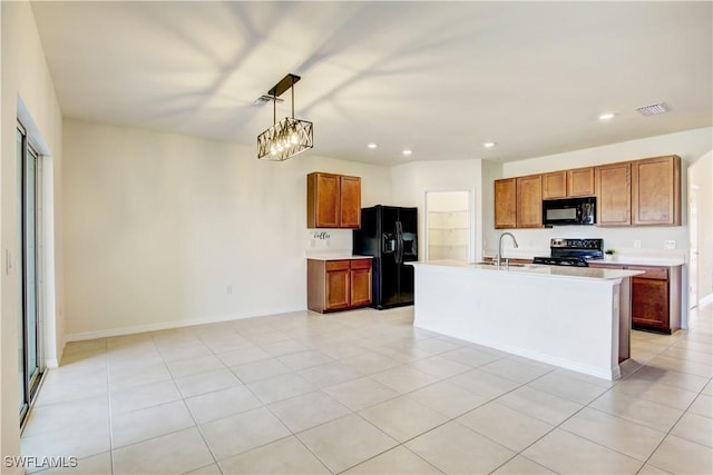 kitchen with light countertops, visible vents, black appliances, and recessed lighting