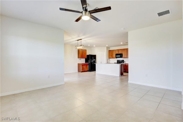 unfurnished living room with a ceiling fan, recessed lighting, visible vents, and baseboards